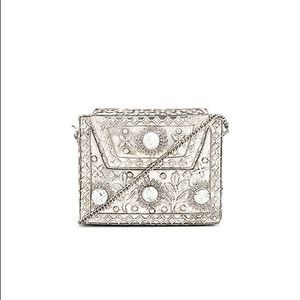 From St Xavier silver clutch bag